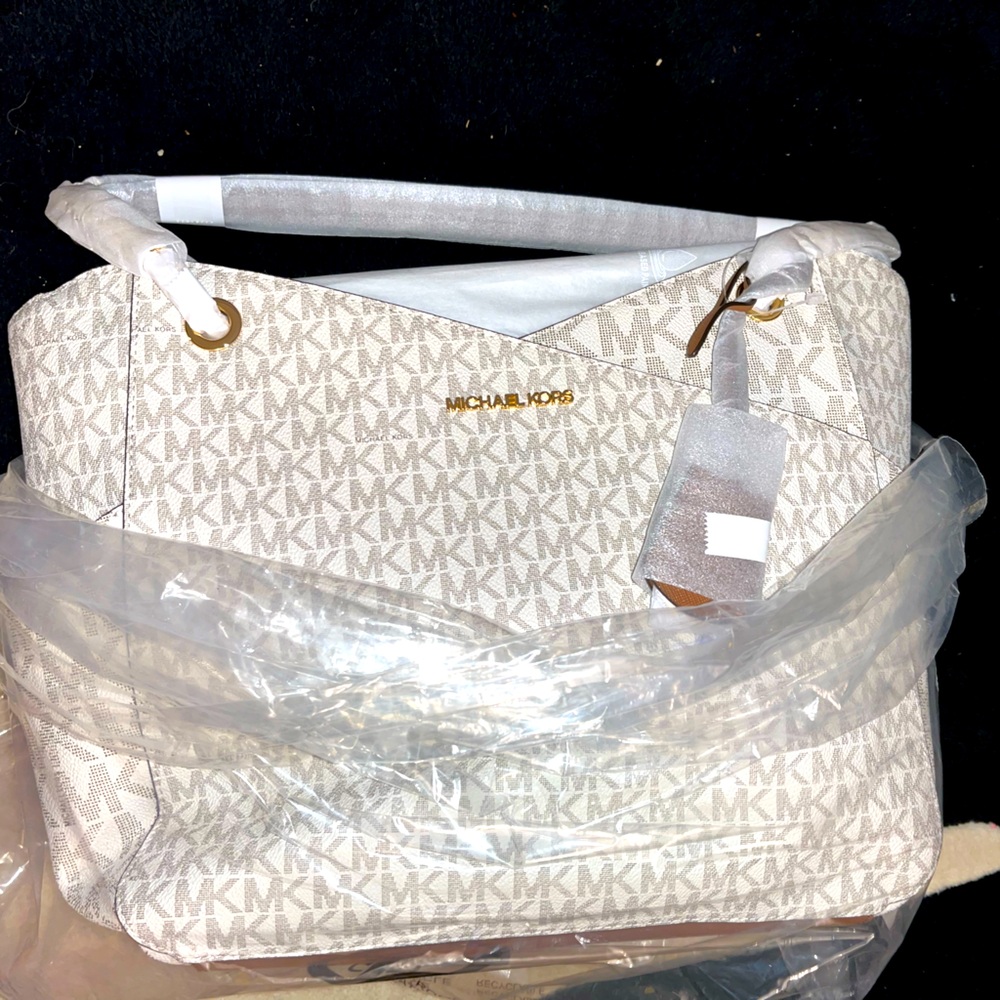 Women’s Michael Kors printed white and brown tote bags